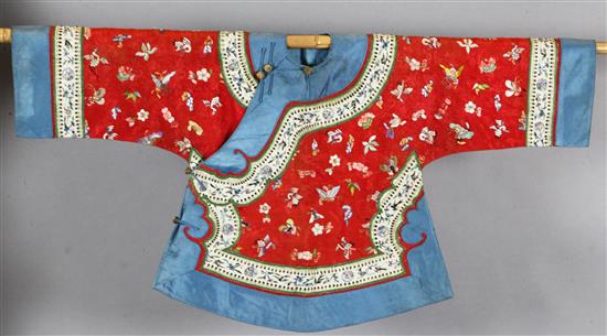 A Chinese embroidered silk red brocade jacket, late Qing dynasty,